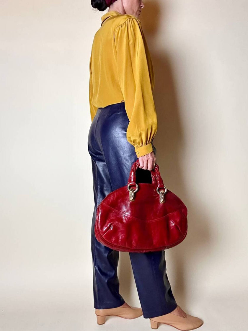 Borsa in pelle rosso bruciato con manici a treccia