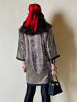 Mini bag a trapezio in ecopelle nera stampa lizard