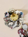 Parure composta da clip e mini bag in paillettes argento