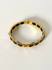 Bracciale vintage Fendi in metallo dorato con inserti in pelle nera intrecciata