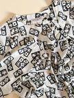 Blusa Yves Saint Laurent in tessuto jacquard bianco e nero fantasia Domino