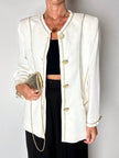 Giacca vintage Yves Saint Laurent bianco latte con serpentine dorate e bottoni gioiello
