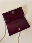 Pochette rettangolare in pitone e pelle bordeaux con tracolla in catena