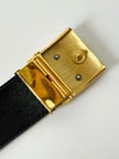 Cintura vintage Yves Saint Laurent in camoscio nero con maxi fibbia oro logata YSL