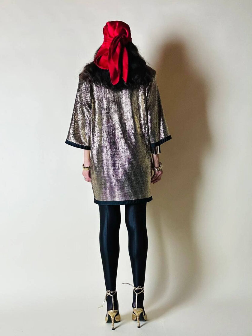 Mini dress oro in tessuto operato con profili neri in raso nero  “Yves Saint Laurent”