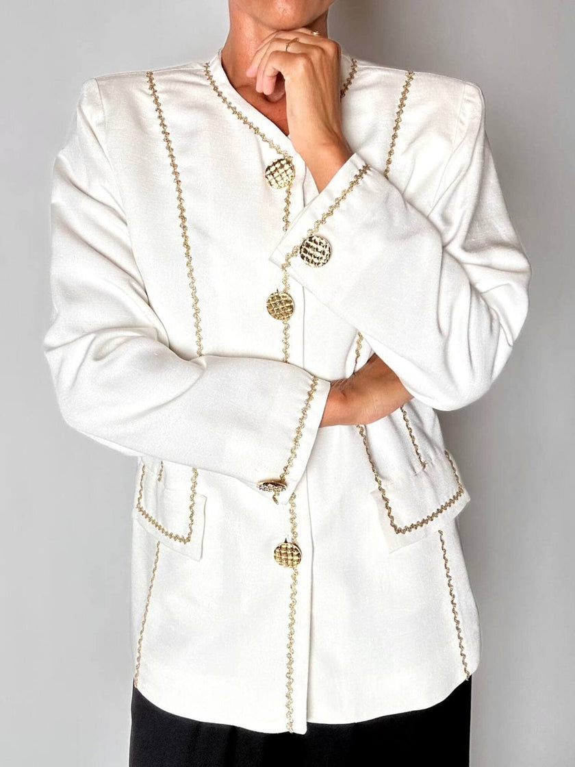 Giacca vintage Yves Saint Laurent bianco latte con serpentine dorate e bottoni gioiello