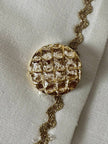 Giacca vintage Yves Saint Laurent bianco latte con serpentine dorate e bottoni gioiello
