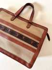 Borsa Yves Saint Laurent in canvas beige con profili color cuoio e motivo greca con logo