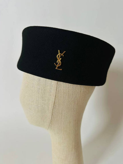 Spilla vintage logo Yves Saint Laurent in metallo color oro