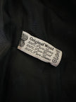 Blazer doppiopetto nero con bottoni dorati “Guaranteed”