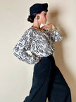 Blusa Yves Saint Laurent in tessuto jacquard bianco e nero fantasia Domino