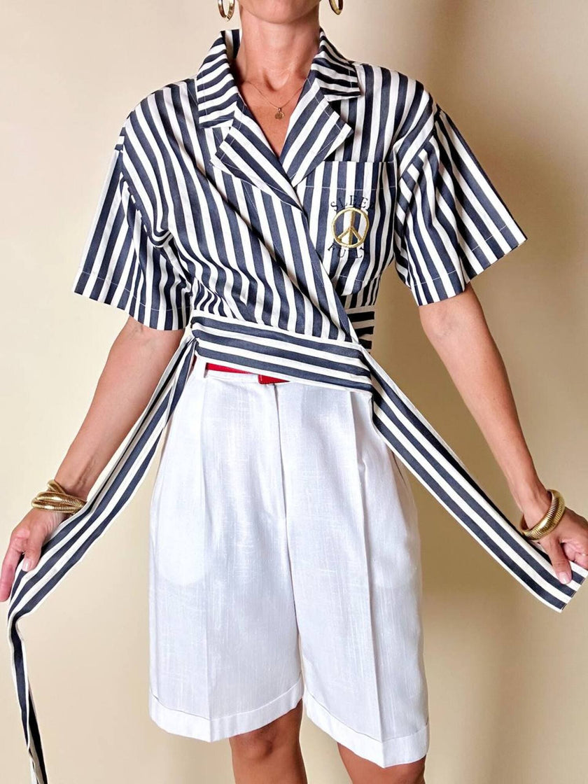 Moschino blue and white striped wrap blouse with embroidered peace symbol
