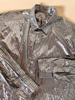 Camicia oversize in lamé argento lavorata a righe