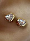 Clip dorate a forma di cuore con strass centrale