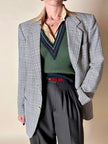 Gilet in lana verde prato con scollo a V e profili a contrasto verde bosco
