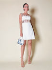 Mini dress bianco con inserti di organza ricamati in paillettes “Luis Mari”