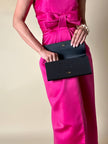 Pochette nera con fiocco in tessuto canneté