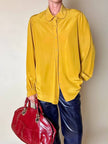 Borsa in pelle rosso bruciato con manici a treccia