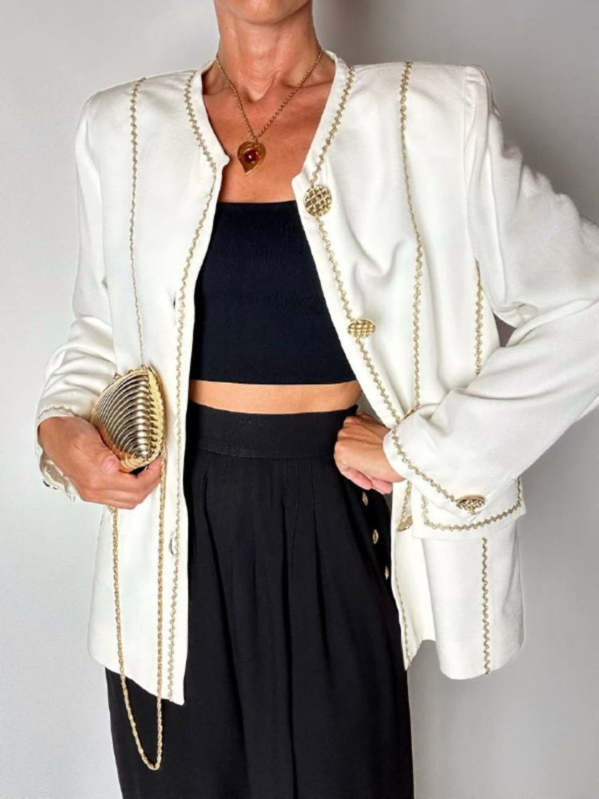 Giacca vintage Yves Saint Laurent bianco latte con serpentine dorate e bottoni gioiello