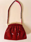 Pochette in whips rossa con tracolla regolabile