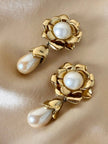 Clip dorate a forma di fiore con perle pendenti “Yves Saint Laurent”