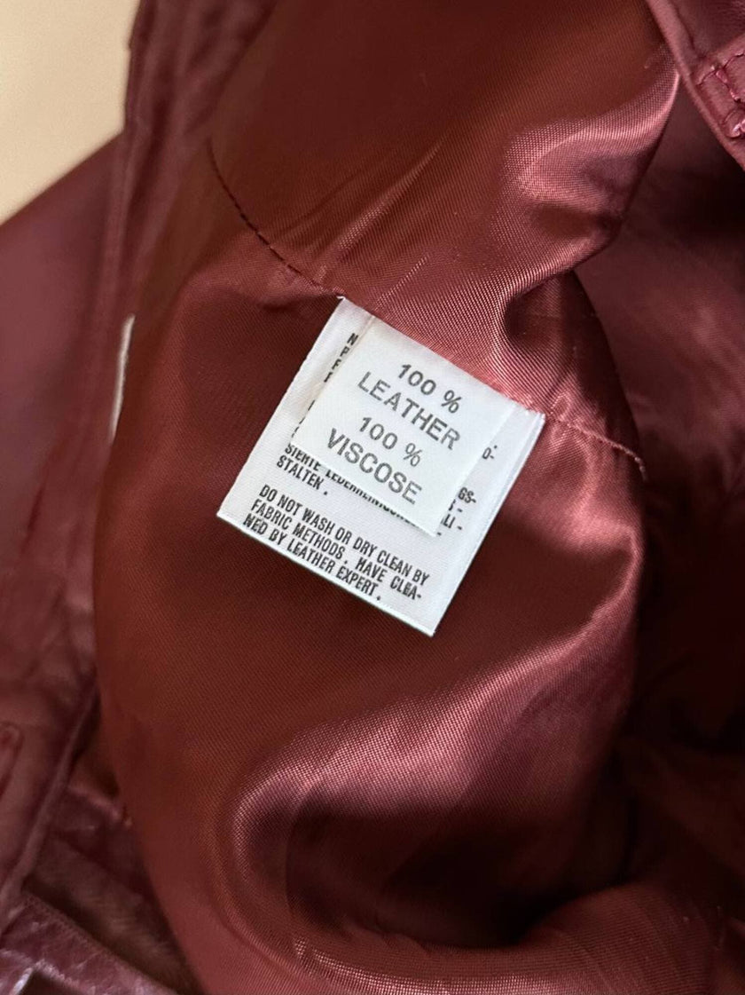 Pantalone in pelle mattone rosato a vita alta con pince e cintura in coordinato La Matta