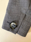 Giacca grigia con martingala “Yves Saint Laurent”