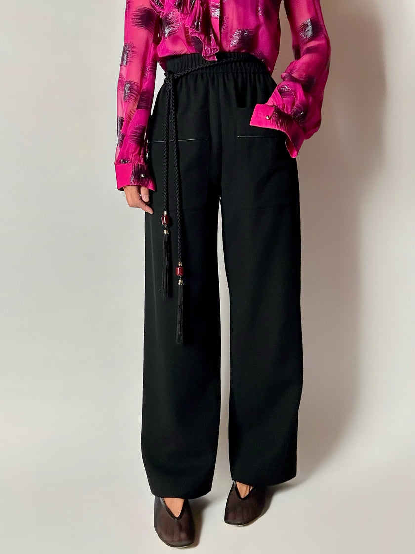 Pantaloni vintage Yves Saint Laurent Variation in lana nera a gamba ampia con tasche applicate