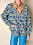 Cardigan Missoni Sport con pattern geometrico e trama tridimensionale nei toni del verde e blu