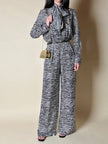 Jumpsuit in seta fantasia zebrata con maxi fiocco al collo
