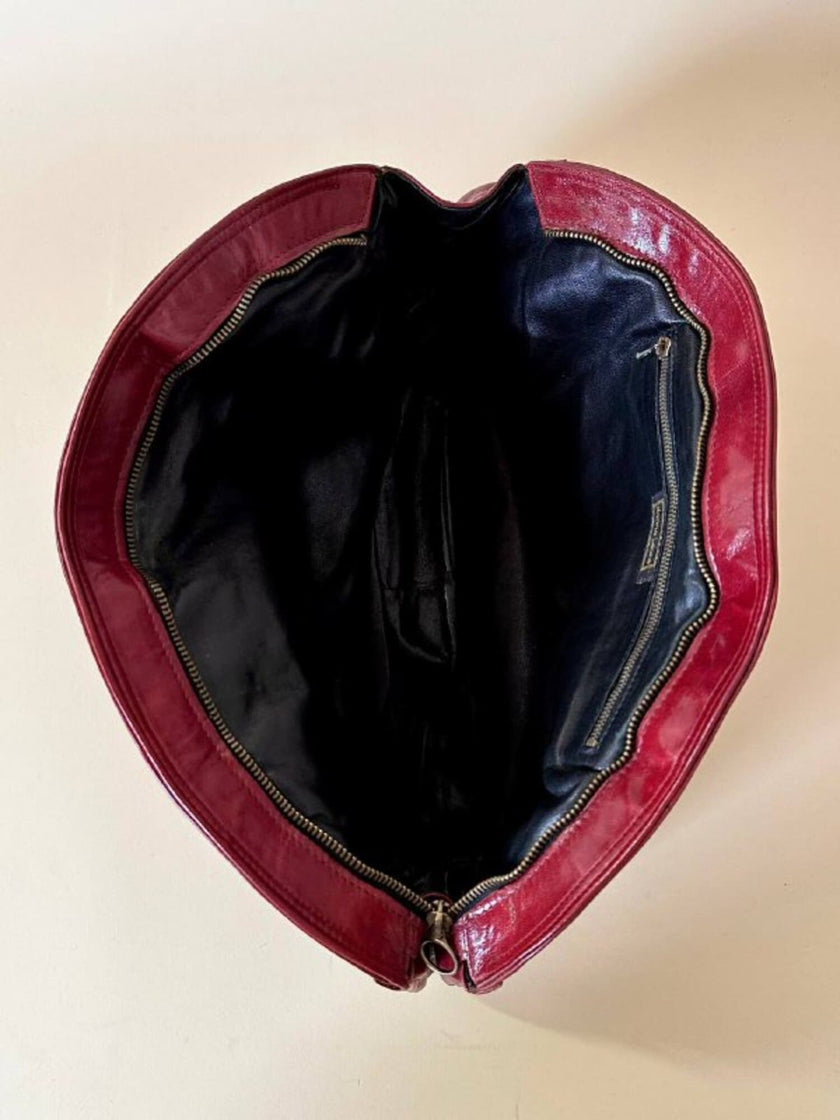 Borsa in pelle rosso bruciato con manici a treccia