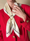 Foulard in seta avorio con profili e logo neri “Yves Saint Laurent”