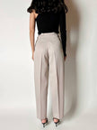 Pantalone vintage in fresco di lana greige con pince e abbottonatura su ambo i lati