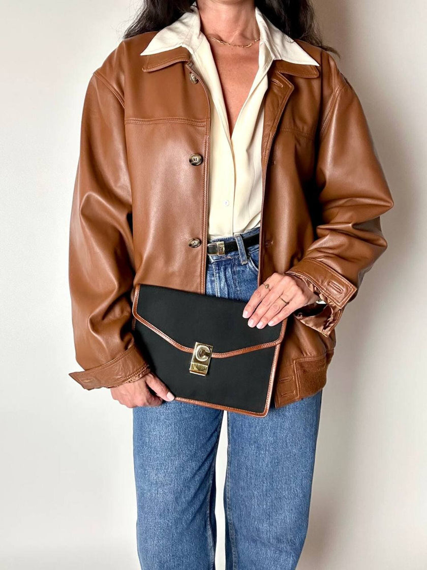 Pochette vintage Celine modello a busta in canvas nero con profili in pelle tabacco