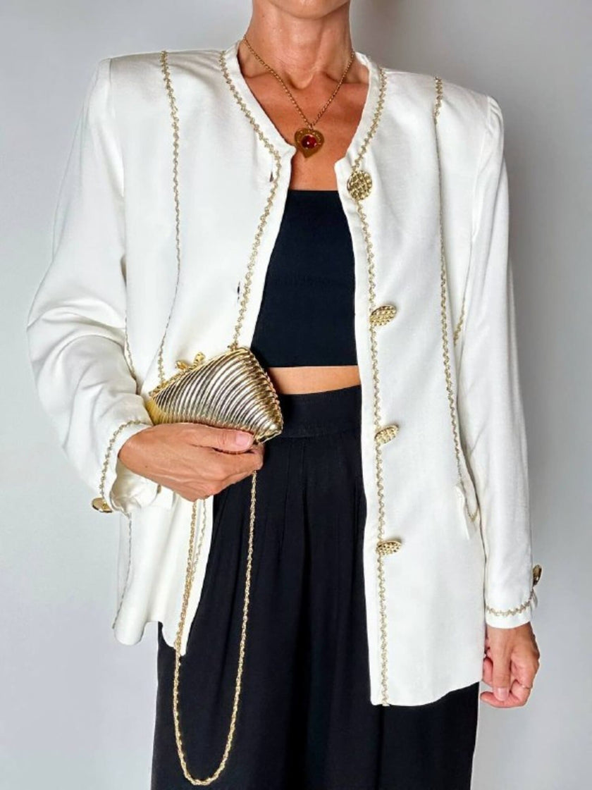 Giacca vintage Yves Saint Laurent bianco latte con serpentine dorate e bottoni gioiello