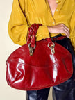 Borsa in pelle rosso bruciato con manici a treccia
