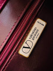 Borsa in camoscio borgogna con infilature in pelle in tinta 