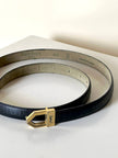 Cintura vintage Yves Saint Laurent in pelle nera con fibbia geometrica oro con logo YSL