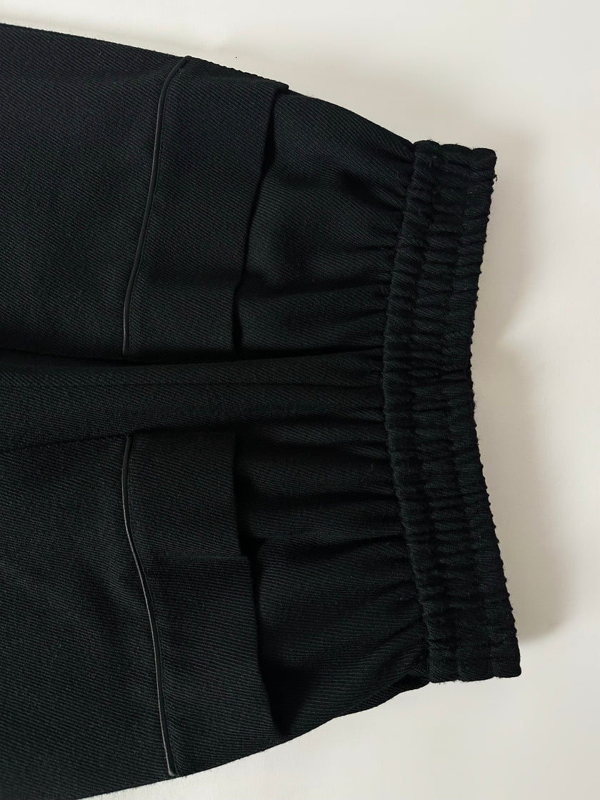 Pantaloni vintage Yves Saint Laurent Variation in lana nera a gamba ampia con tasche applicate