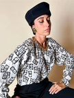 Maxi orecchini a clip dorati con logo YSL 