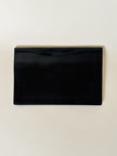 Pochette vintage Yves Saint Laurent in pelle nera con greca logata in rilievo