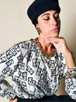 Maxi orecchini a clip dorati con logo YSL 