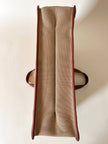 Borsa Yves Saint Laurent in canvas beige con profili color cuoio e motivo greca con logo