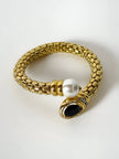 Bracciale vintage in metallo dorato con perla onice nero e cristalli