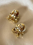Clip con perle cabochon e piccoli fiocchi incastonati con strass “Nina Ricci”