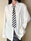 Cravatta in raso jacquard a righe diagonali bianche e nere