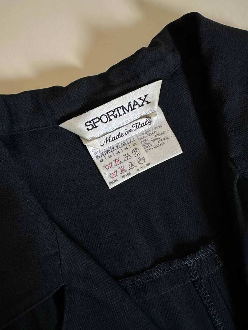 Jumpsuit Sportmax nera con abbottonatura frontale e pantalone con piega