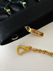 Pochette vintage Rodo in raso nero lavorato a rete con nappa couture e tracolla in catena
