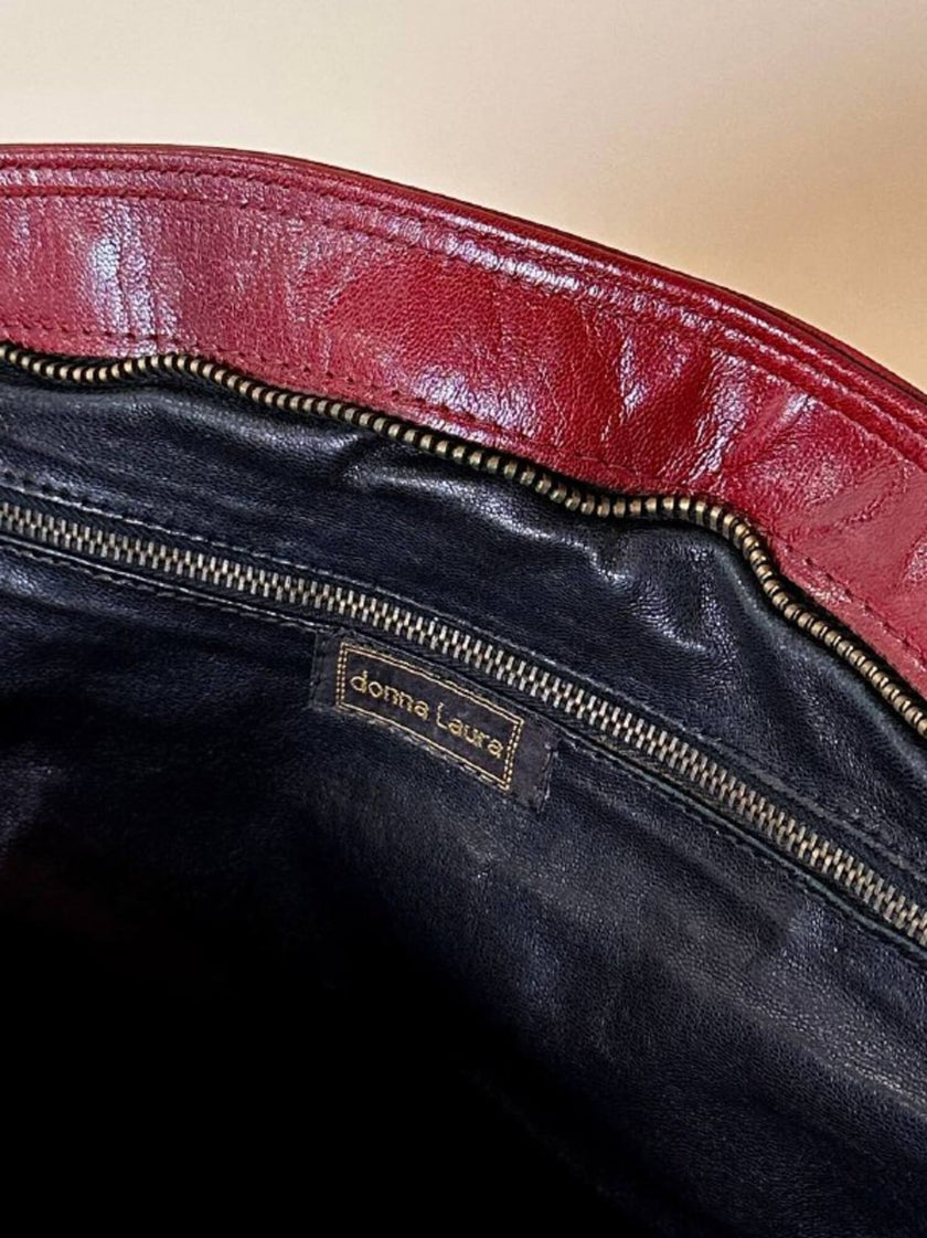 Borsa in pelle rosso bruciato con manici a treccia