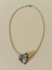 Collier argento con ciondolo a forma di cuore e cristalli incastonati “Yves Saint Laurent”